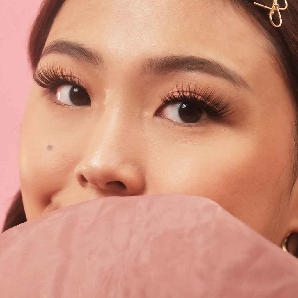 Asian woman wearing Lulu Lashes Highkey false eyelashes