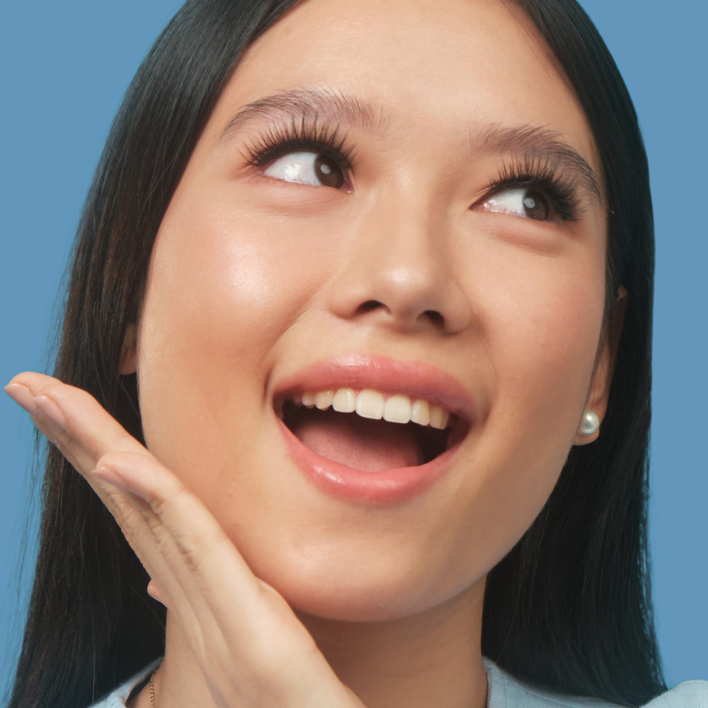 Asian woman wearing Lulu Lashes Clearly false eyelashes