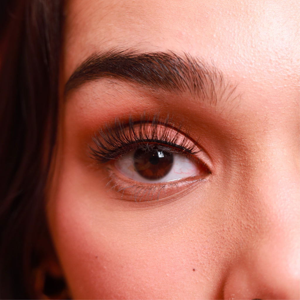 closeup of eye of brown woman wearing best fake eyelash extensions clearly divine cruelty free vegan false eyelashes | lulu lashes