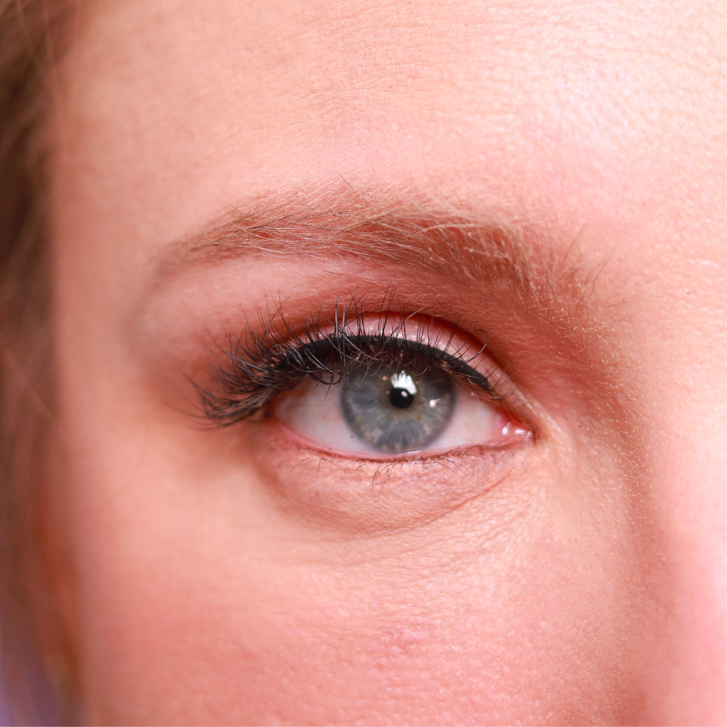 closeup of eye of caucasian woman wearing best fake eyelash extensions lowkey foxy cruelty free vegan false eyelashes | lulu lashes