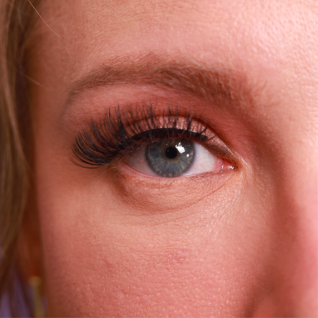 closeup of eye of caucasian woman wearing best fake eyelash extensions lowkey trendy cruelty free vegan false eyelashes | lulu lashes